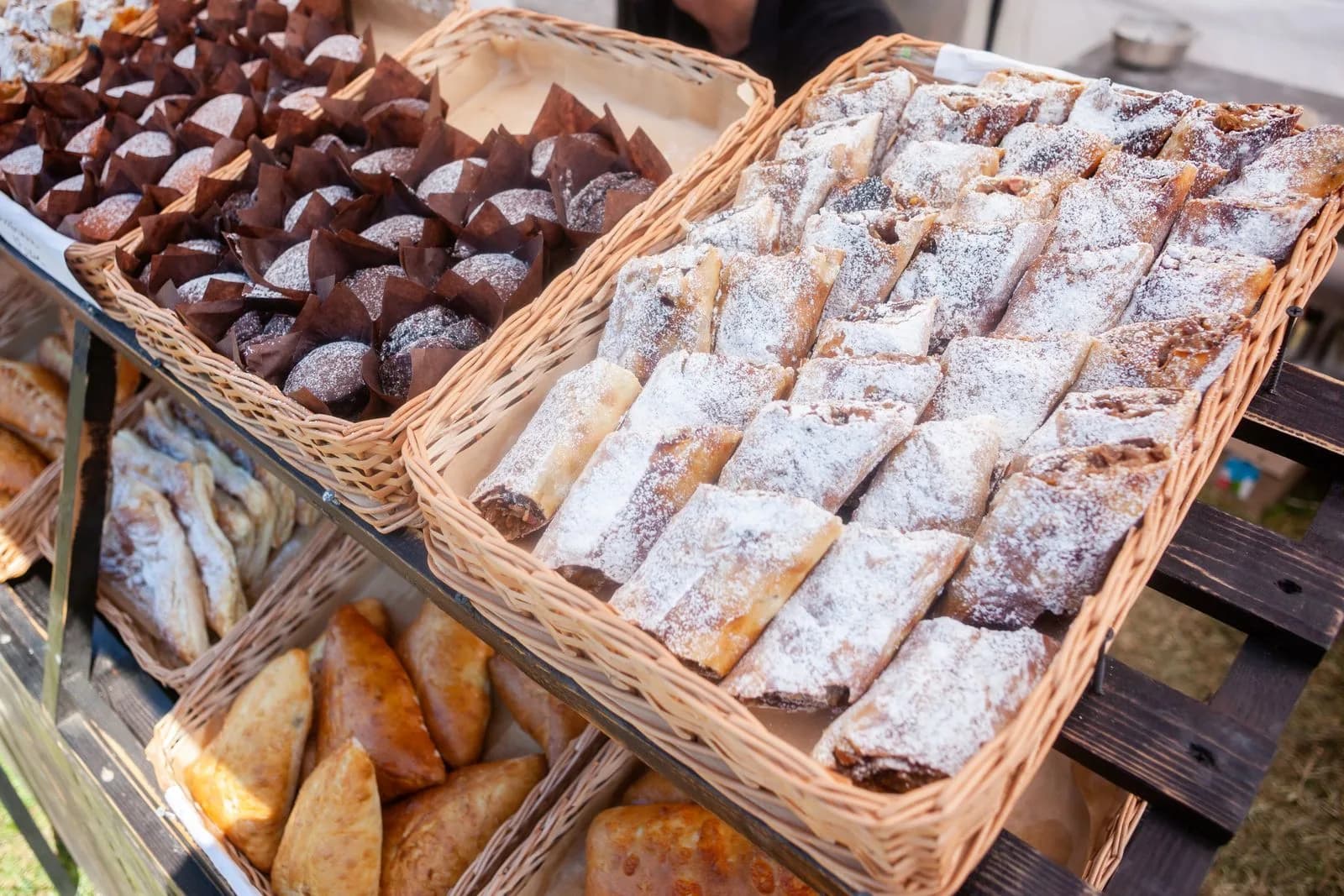 Baskets of pastries and baking on a fundraising stall